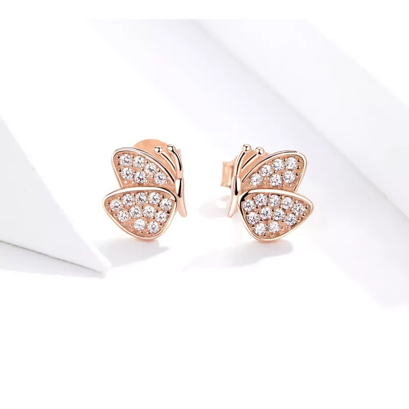 (imagen para) Estos aretes de estilo Pandora en color oro rosa tienen forma de mariposa - SCE7 - Ver 4